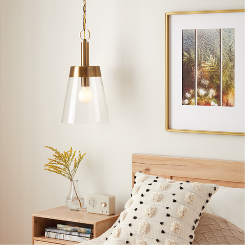 bedroom with gold pendant light