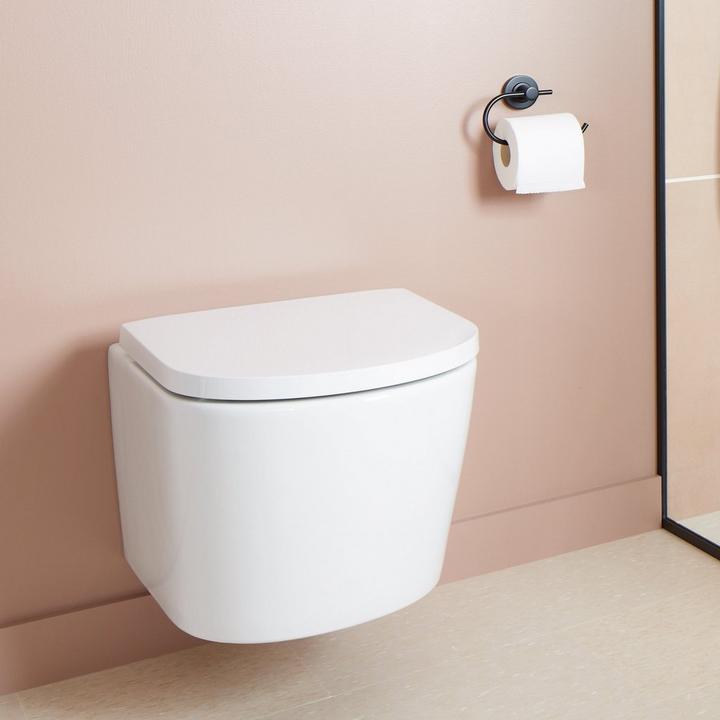 bathroom with tankless smart toilet