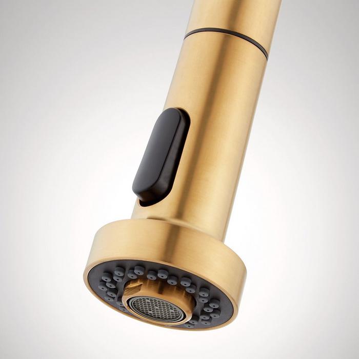 Closeup of the Ridgeway Pull-Down Touchless Kitchen Faucet spray button in Brushed Gold