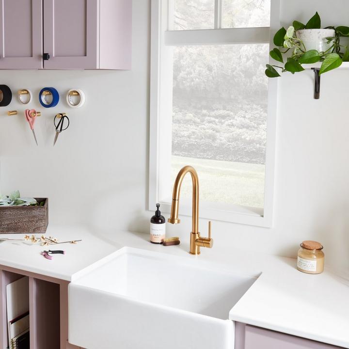 Craft room with the Ridgeway Pull-Down Touchless Kitchen Faucet in Brushed Gold, 27" Rowena Fireclay Farmhouse Sink