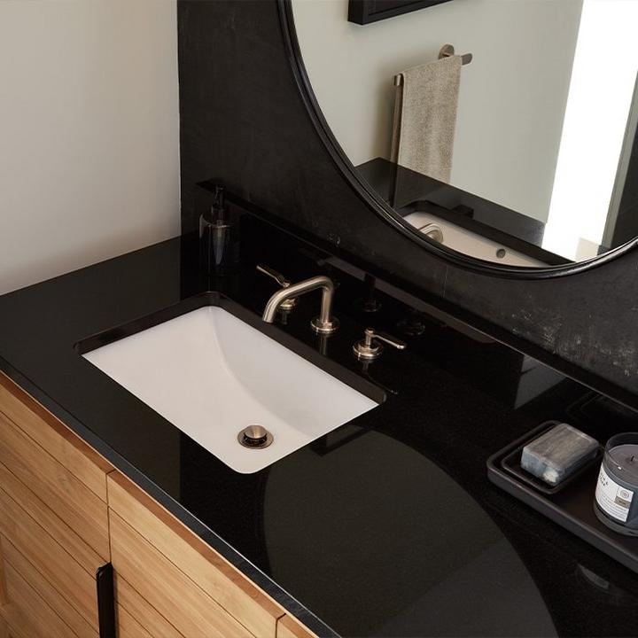 bathroom vanity with black granite vanity top