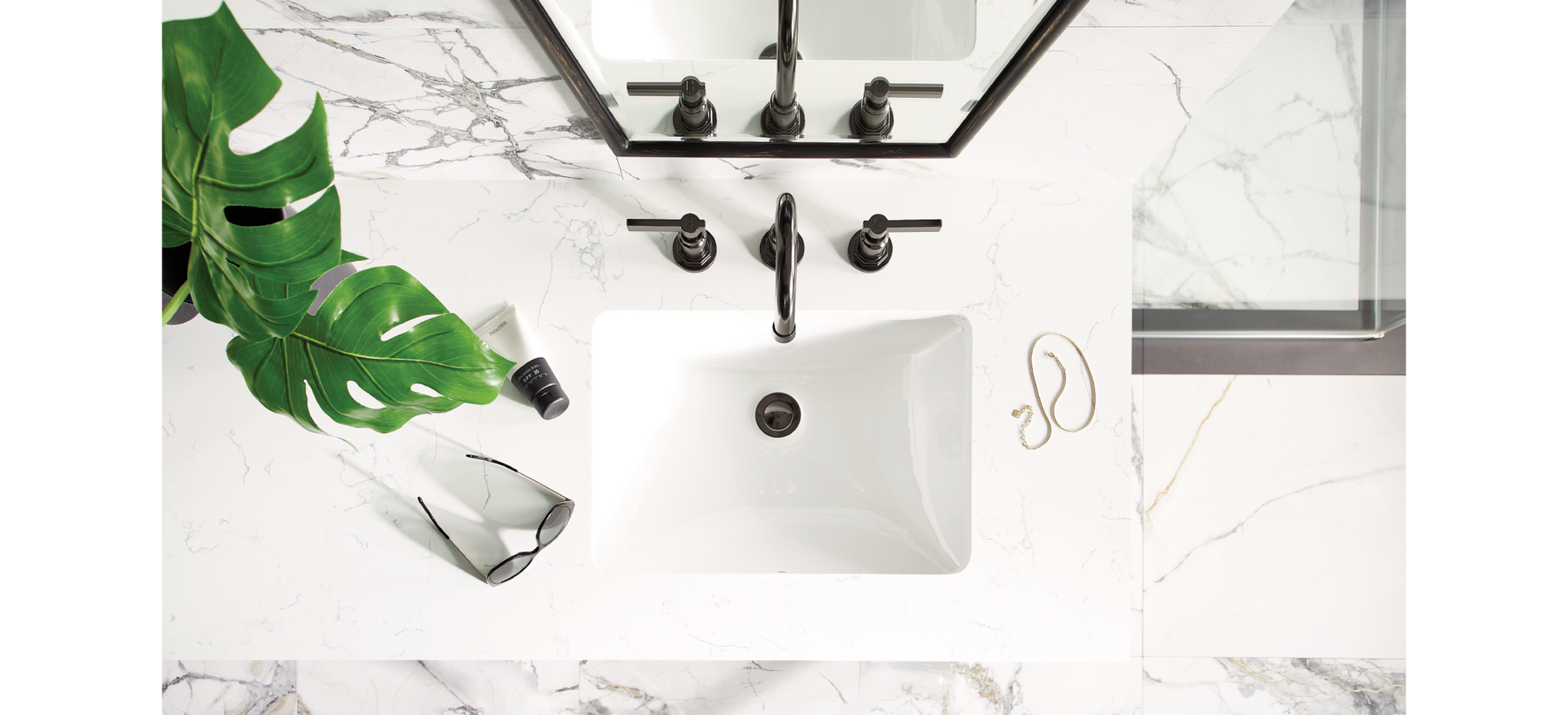 Greyfield Freestanding Faucet in Gunmetal on a Feathered White Quartz Vanity Top for quartz countertop care and maintenance