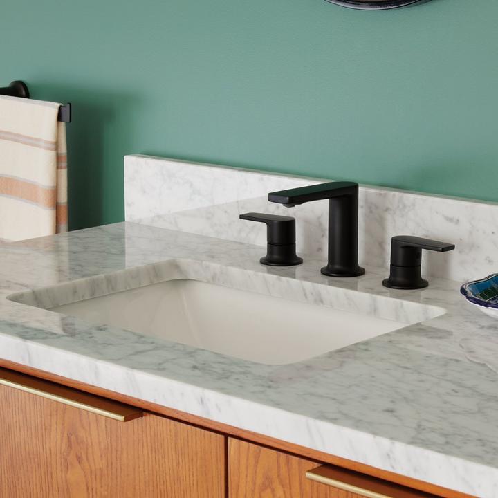 Berwyn Widespread Bathroom Faucet in Matte Black  on Carrara Marble Vanity Top