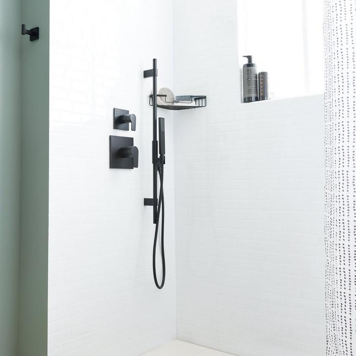Open bathroom concept with the Hibiscus Shower System with Hand Shower and Slide Bar in Matte Black