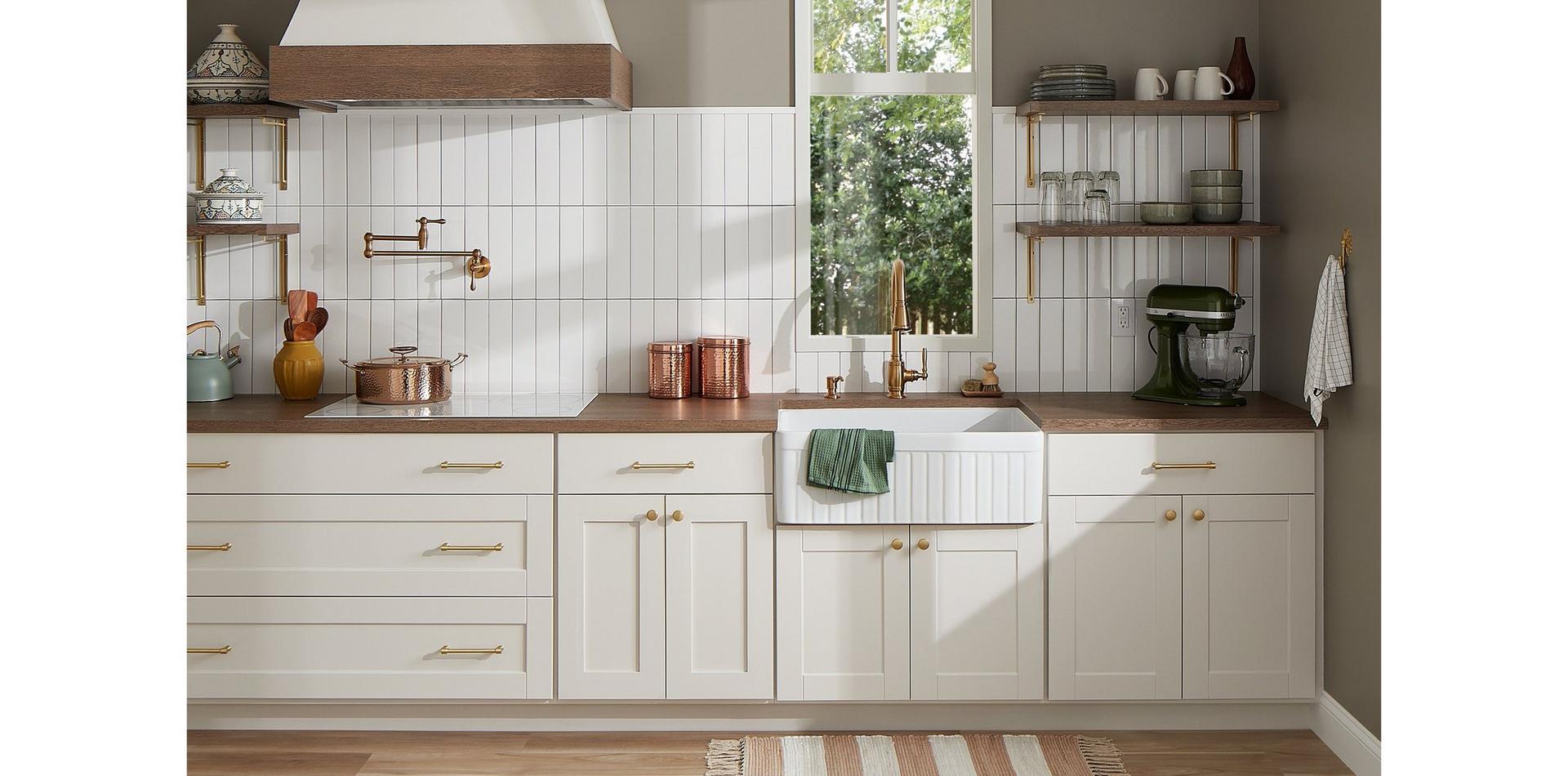 White kitchen with the Finnian Kitchen Faucet, Traditional Wall-Mount Pot Filler in Brushed Gold, Curington Farmhouse Sink